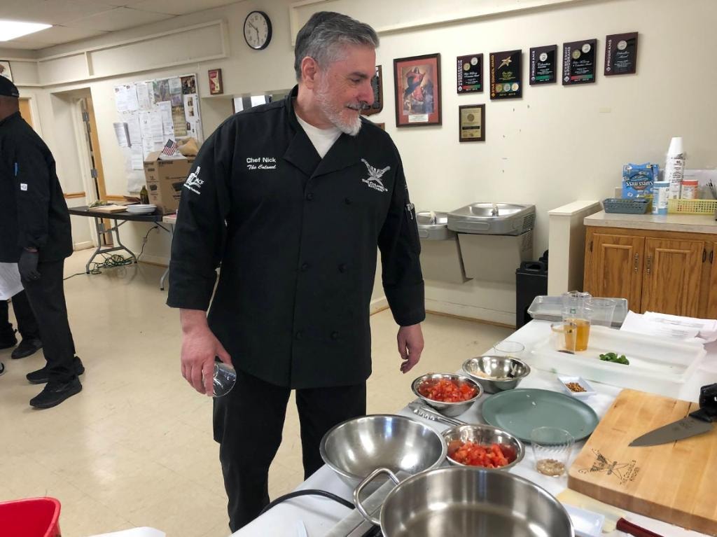 Chef Nick demonstrating Italian cooking at a lodge event