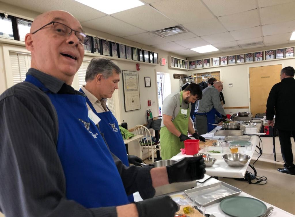Members participating in the lodge cooking class