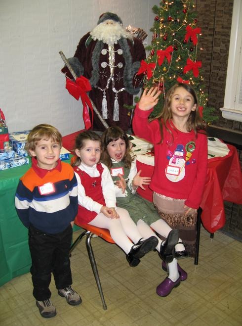 Children with Santa at the holiday party