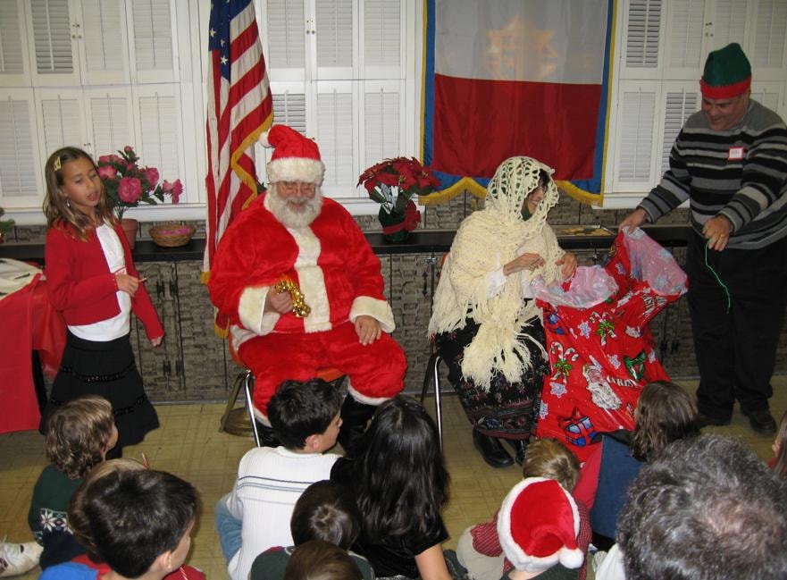 Santa visiting children at a lodge event