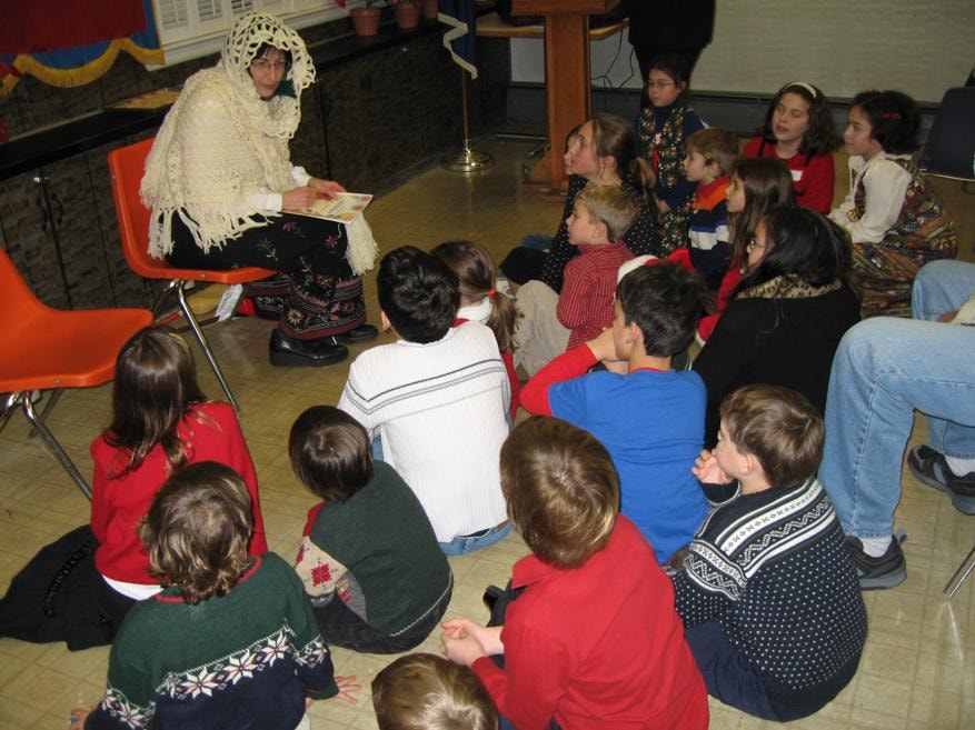 Storyteller entertaining children at a lodge event