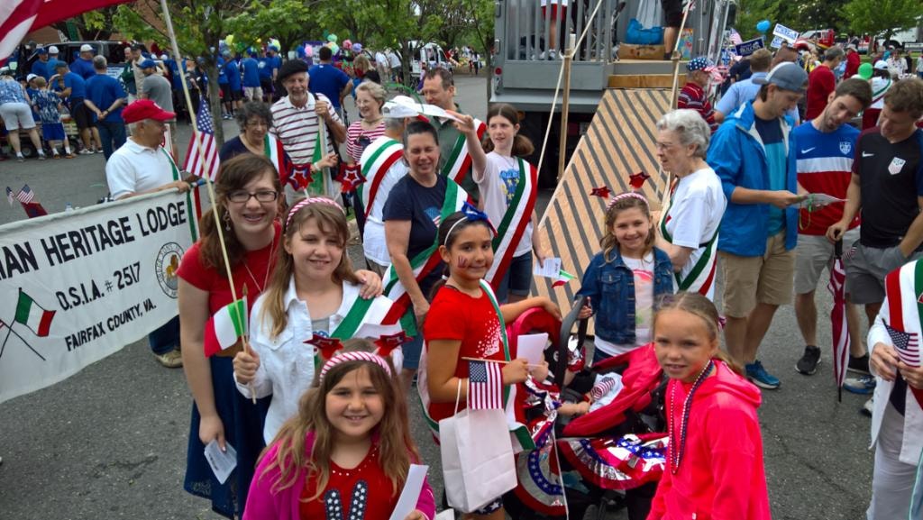 Children with Italian and American flags at the parade